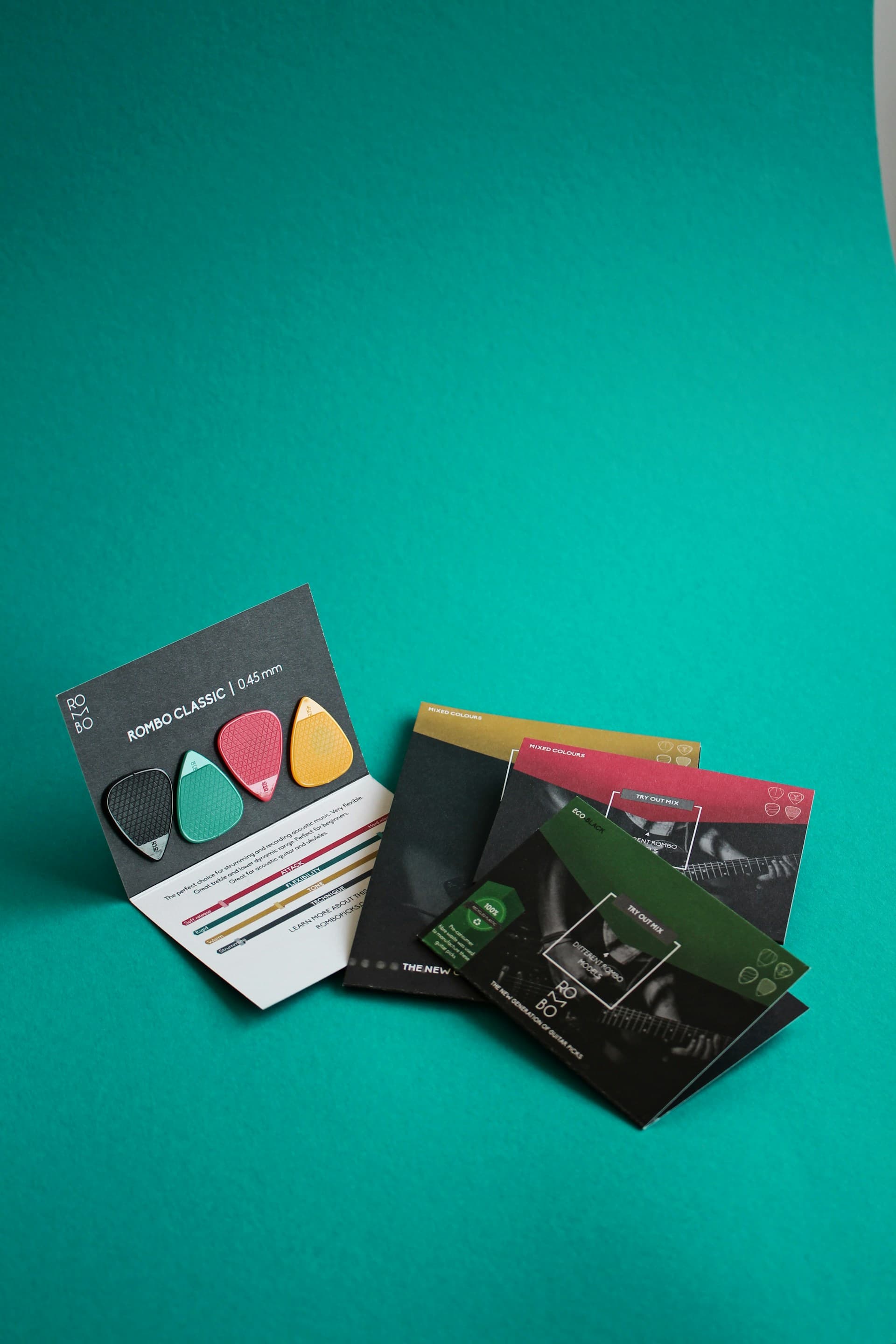Branded product packaging on a teal background